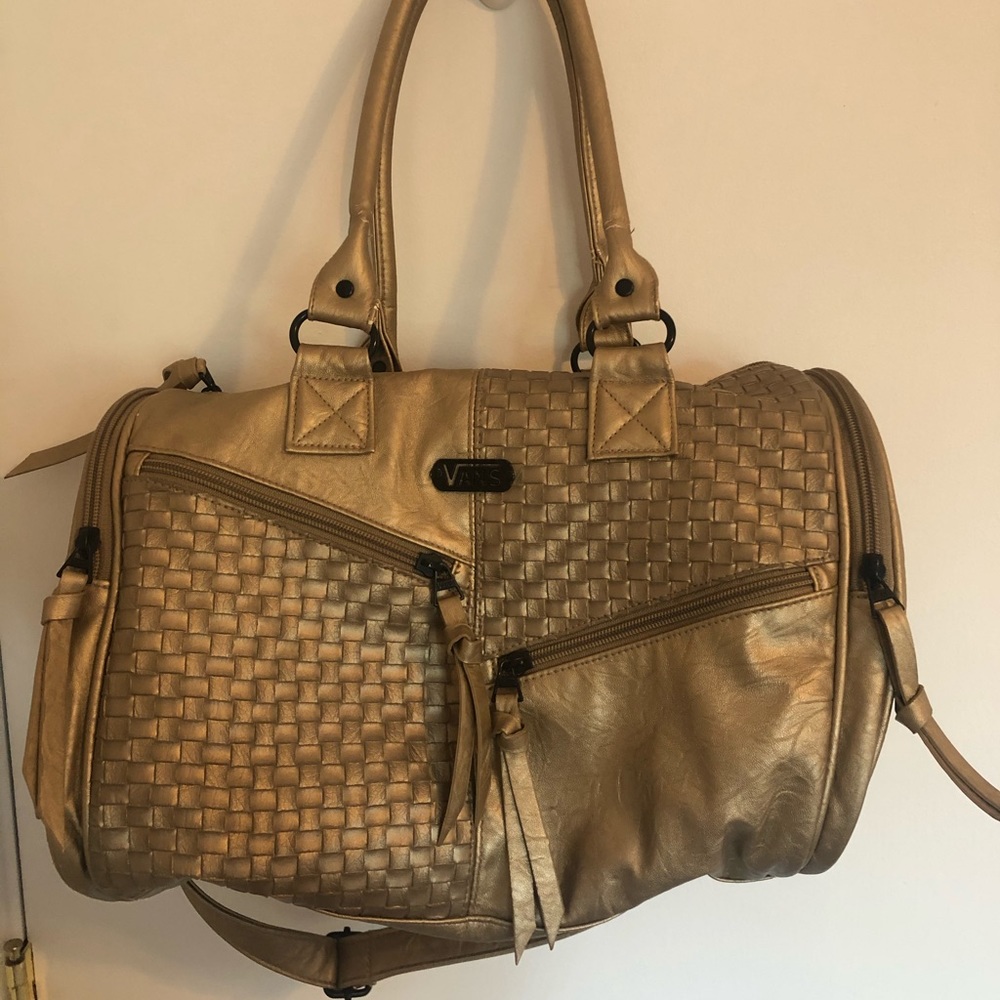 Vans Duffel style purse with adjustable strap.